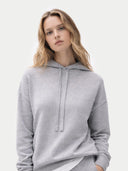 Woman wearing a gray hoodie on a white background  #color_high-rise
