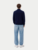 back view of a Person wearing a navy cardigan and light blue jeans on a white background #color_navy