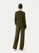 back view of Person wearing a green outfit with a matching beanie on a white background #color_capulet-olive