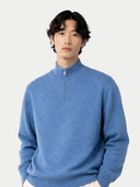 Man wearing a blue sweater with a zipper on a light gray background color_blue