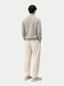 back view of Person wearing a gray sweater and beige pants on a white background #color_dawn-blue