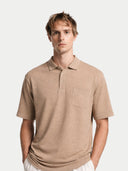 Man wearing a beige polo shirt on a white background #color_timber-wolf