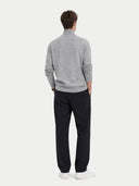 back view of a Person wearing a gray sweater and black pants on a white background #color_vapor-blue