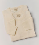 Folded cream sweater with 'Gobi' branding on a light gray background