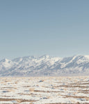 Snowy mountain range with a clear blue sky