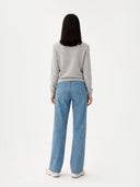 back view of a light blue jeans and a gray sweater on a white background #color_dawn-blue