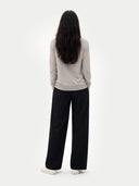 back view a light gray sweater and black pants on a white background #color_dawn-blue