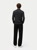 back view of a dark gray long-sleeve shirt and black pants on a white background #color_charcoal
