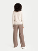 back view of a beige sweater and brown pants on a white background #color_off-white