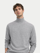Man wearing a gray turtleneck sweater on a white background #color_vapor-blue