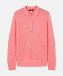 Pink ribbed sweater with button details on a light gray background