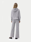 back view of person wearing a gray hoodie and pants on a white background  #color_high-rise