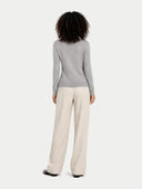 back view of a person wearing a gray sweater and beige pants on a white background #color_high-rise