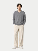 front view of  a man wearing a gray sweater and white pants on a white background #color_dim-gray