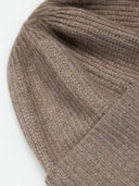 Close-up of a brown knitted fabric on a white background #color_taupe
