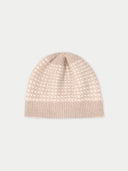 Beige knit beanie on a light gray background #color_warm-grey