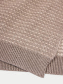 Close-up of a textured brown fabric with a white background #color_taupe