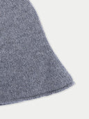 Close-up of a textured gray fabric corner on a white background #color_dim-gray