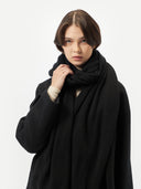woman wearing a black scarf with coat #color_black