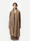 woman wearing a brown scarf and coat #color_taupe