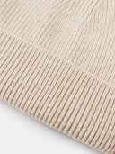 Close-up of a textured beige fabric surface #color_beige