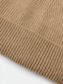 Close-up of a brown knitted fabric on a white background #color_taupe