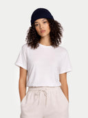 Person wearing a white t-shirt and navy headband on a white background #color_navy-blazer