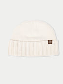 White knit beanie with a brand logo on a light gray background #color_white