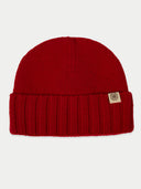 Red knit beanie with a brand label on a white background #color_chili-pepper