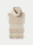 A beige loop-stitch gilet with frayed edges and a turtleneck design. #color_warm-grey