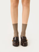 front view of taupe colored ribbed socks with loafers on a white background #color_taupe