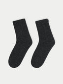Pair of dark gray socks on a light gray background #color_charcoal