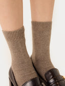close up of taupe colored socks with high heels loafers #color_taupe