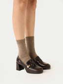 close up side view of brown socks with heels on a white background #color_taupe