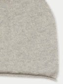 A close-up shot of a gray-colored knit hat on a gray background #color_dawn-blue