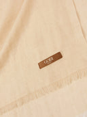 Beige scarf with a brown label featuring the brand 'GOBI'.