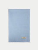 Light blue fabric with a brand label on a white background