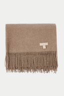 Brown blanket with fringes and a visible brand logo on a white background
