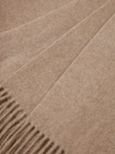 Close-up of a brown fabric with a subtle pattern