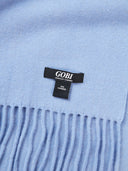 Close-up of a light blue scarf with a Gobi label. #color_english-manor