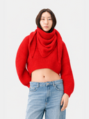 Oval-Sleeve Cropped Cashmere Sweater in bright red worn casually with high-waisted jeans.