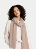 Woman wearing a beige scarf against a white background #color_taupe