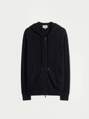 A black zip-up hoodie with a drawstring hood and kangaroo pockets, displayed flat against a light off-white background.