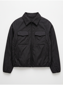A black lightweight zip-up jacket with a pointed collar, long sleeves, and two front flap pockets, shown flat against a light gray background.