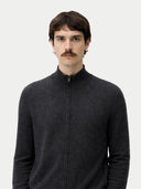 Man wearing a dark gray zip-up sweater against a white background #color_charcoal