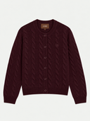 A burgundy cable-knit cardigan sweater with a button-up front and a small embroidered crest on the chest, shown flat against a light gray background. The brand label 'GOBI' is visible inside the collar.