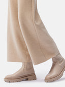 close up bottom view of wide leg pants #color_beige