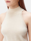 close up of a white mock neck sleeveless top #color_off-white