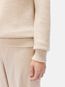 close up of a beige sweater and pants on a white background #color_off-white