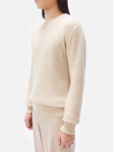 close up of a beige sweater #color_off-white
